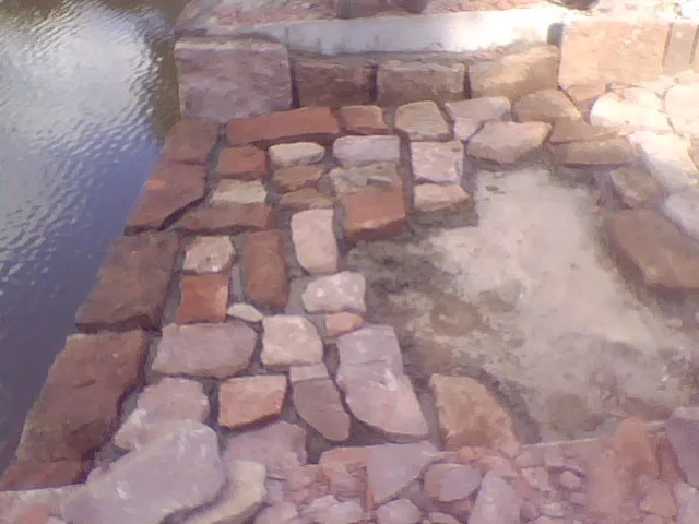 Natural stone water management feature Choate Hall