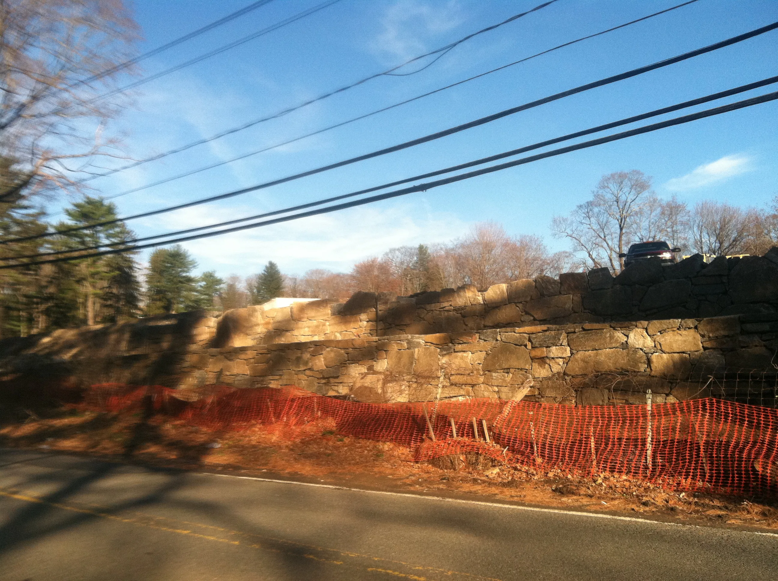 Large boulder stone retaining wall Stanwich School Greenwich CT