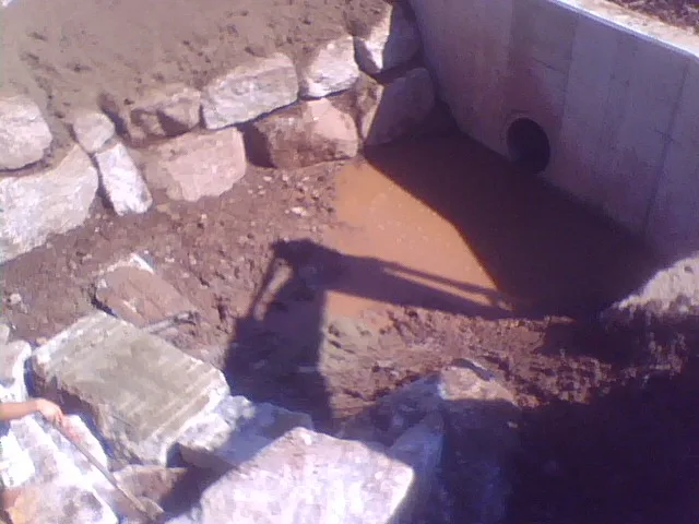 Stone dam construction site view Choate Hall