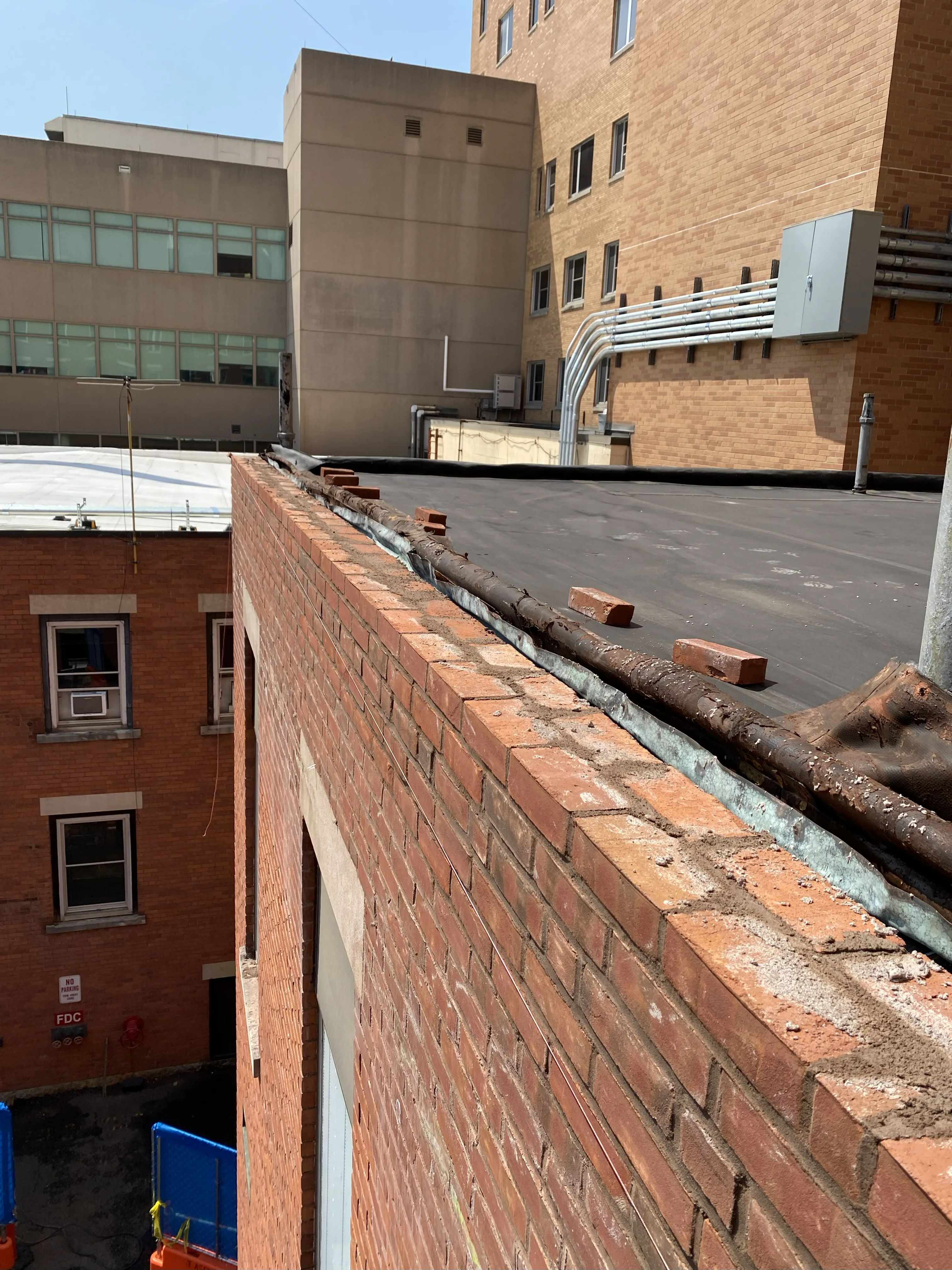 Parapet masonry restoration work at Saint Mary's Hospital