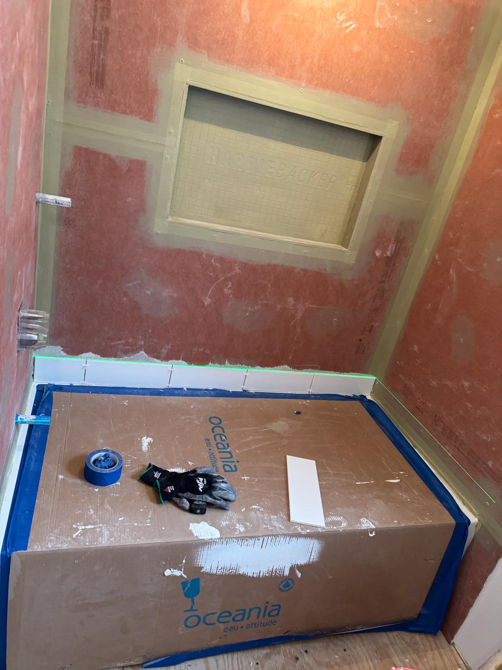 Bathroom subfloor with waterproofing membrane and flooring tools