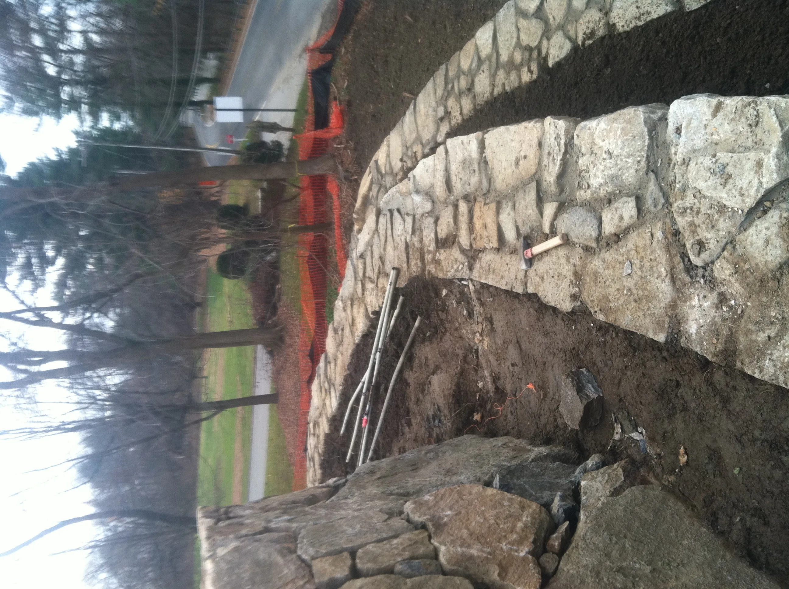 Three tier stone retaining wall final view Stanwich School CT