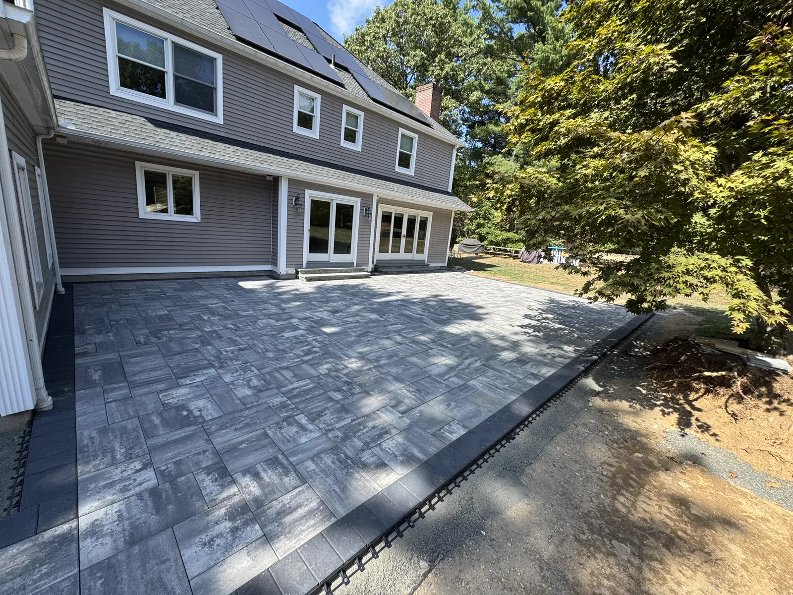 Completed paver patio installation at residential Connecticut home
