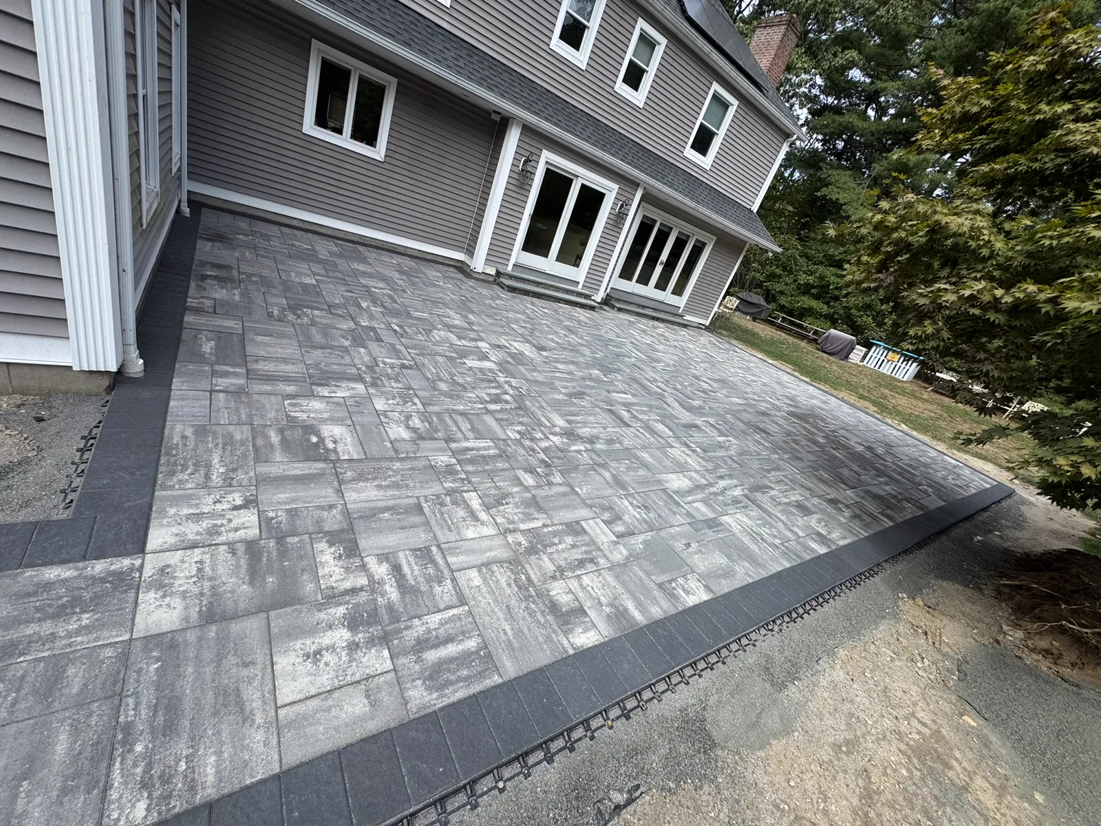 Paver laying in progress residential backyard CT
