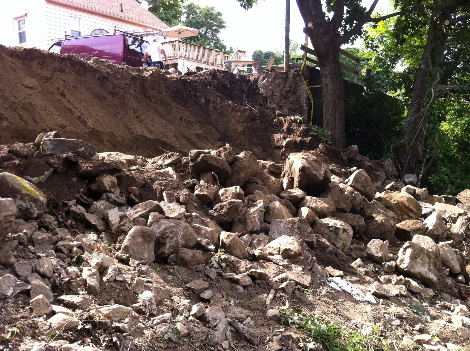 Failed retaining wall and collapsed slope before reconstruction